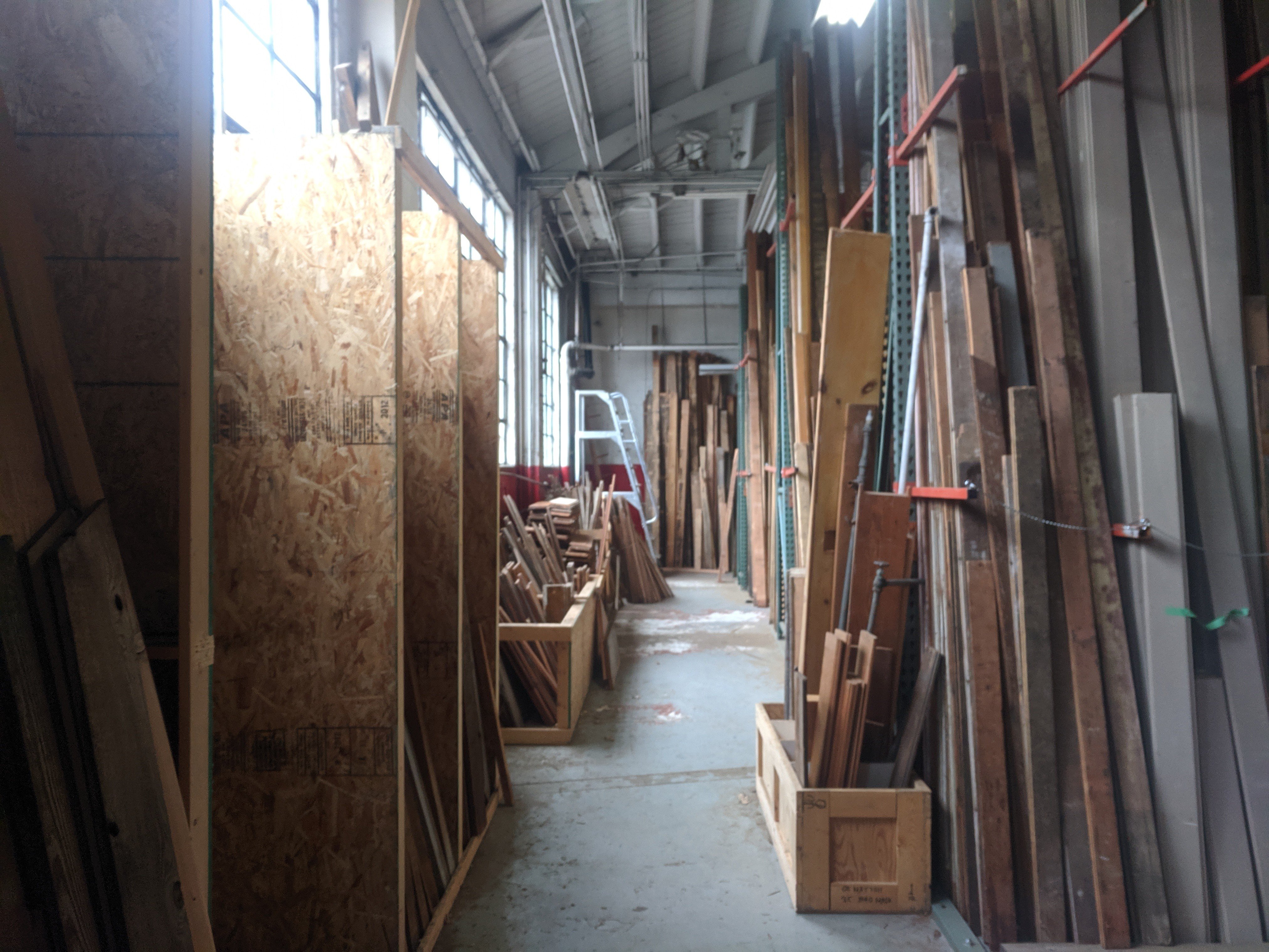 Photo of walkway surrounded by lots of different types of wood